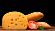 block of cheese and bread isolated on black