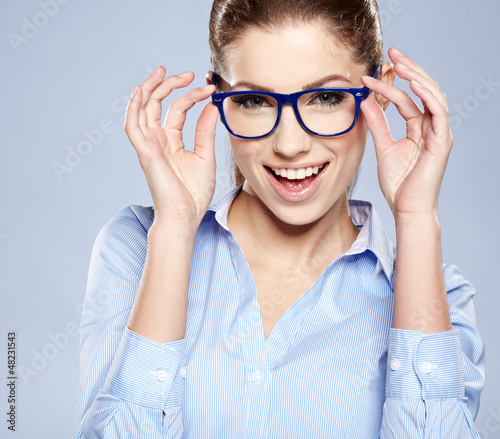 Photo: business woman in glasses on sky background business woman in glasses on sky background