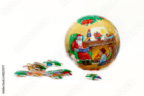 Photo: christmas ball puzzle from parts isolated christmas ball puzzle from parts isolated