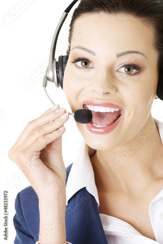 Photo: Beautiful young call-center assistant Beautiful young call-center assistant