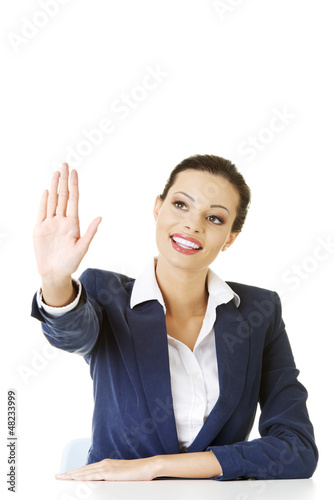 Photo: Businesswoman making choose on abstract screen Businesswoman making choose on abstract screen