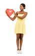 Pretty African American woman holding Red Heart Balloon isolated