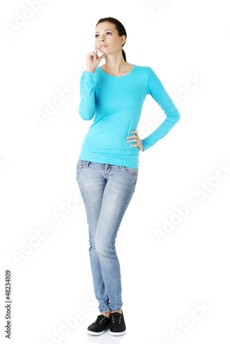 Photo: Thoughtful female student looking up Thoughtful female student looking up