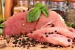A large piece of pork marinated with herbs and spices close-up