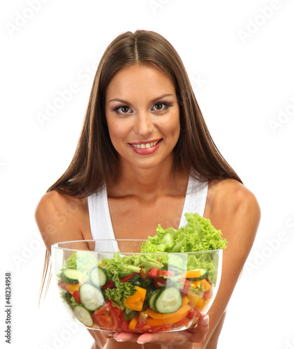 Photo: beautiful young woman with salad, isolated on white beautiful young woman with salad, isolated on white