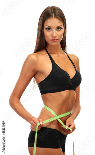 Photo: beautiful young woman with measuring tape, isolated on white beautiful young woman with measuring tape, isolated on white
