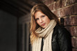 Photo: Teenage girl against a brick wall Teenage girl against a brick wall