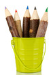 Colorful wooden pencils in green pail isolated on white