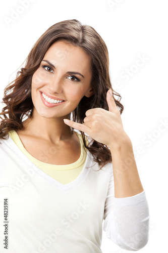 Photo: Beautiful woman showing call me gesture, isolated Beautiful woman showing call me gesture, isolated
