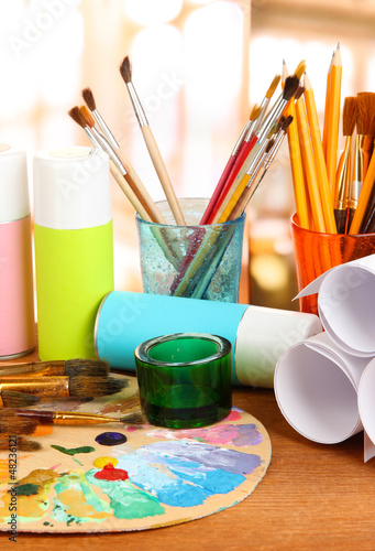 Photo: Artistic equipment: paint, brushes and art palette Artistic equipment: paint, brushes and art palette