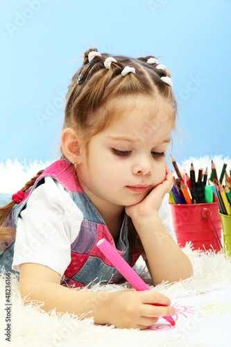 Photo: cute little girl playing with multicolor pencils, cute little girl playing with multicolor pencils,