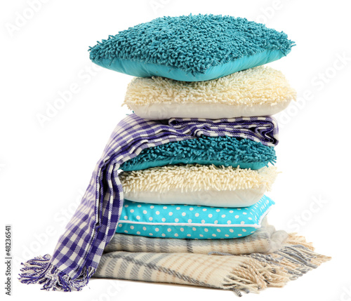 Photo: Hill colorful pillows and plaids isolated on white Hill colorful pillows and plaids isolated on white