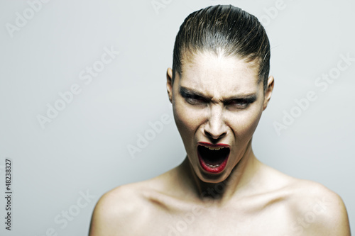 Photo: Beautiful woman shouting angry Beautiful woman shouting angry
