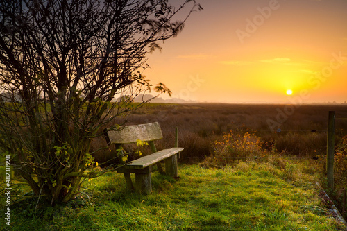 Photo: rest place with bench at sunrise rest place with bench at sunrise