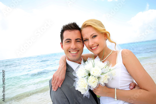 Photo: Just married couple at the beach Just married couple at the beach