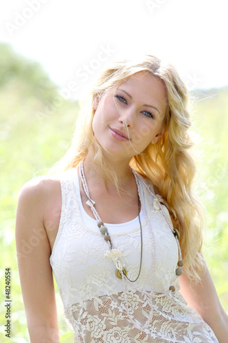 Photo: Portrait of attractive woman in countryside Portrait of attractive woman in countryside