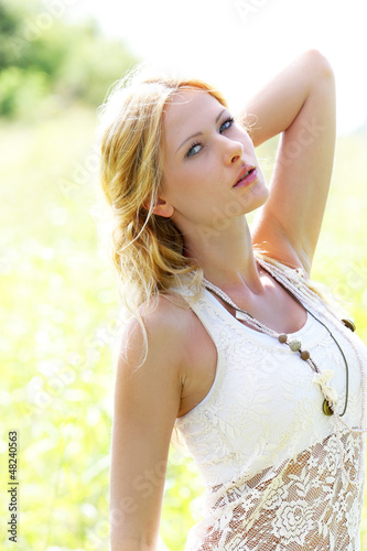 Photo: Portrait of attractive woman in countryside Portrait of attractive woman in countryside