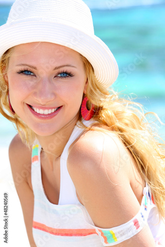 Photo: Cheerful girl in vacation at the beach Cheerful girl in vacation at the beach