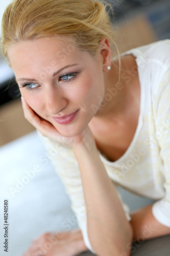 Photo: Portrait of beautiful blond woman with hand on chin Portrait of beautiful blond woman with hand on chin