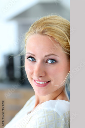 Photo: Attractive woman smiling at camera Attractive woman smiling at camera