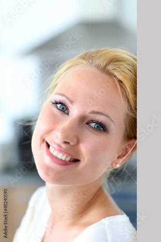 Photo: Attractive woman smiling at camera Attractive woman smiling at camera