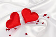Photo: two red heart on white silk two red heart on white silk