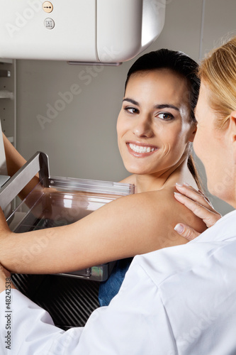 Photo: Young Female Patient Undergoing Mammogram X-ray Test Young Female Patient Undergoing Mammogram X-ray Test