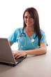 Photo: Young hispanic nurse working on computer Young hispanic nurse working on computer
