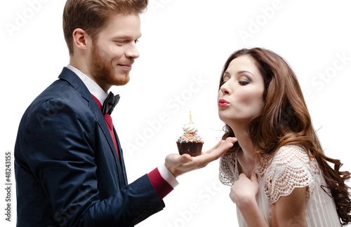 Photo: Man presents birthday sponge cake to his lovely girlfriend Man presents birthday sponge cake to his lovely girlfriend