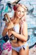 Portrait Of A Young Grunge Woman On Graffiti Wall