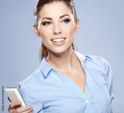 Photo: Happy woman phone talking. Face with toothy smile Happy woman phone talking. Face with toothy smile