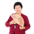 Oriental senior woman with Chinese Fan