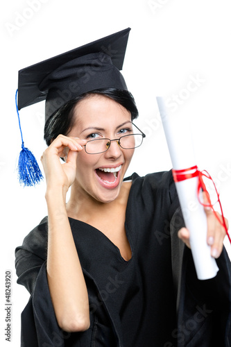 Photo: Graduating student in glasses with the diploma Graduating student in glasses with the diploma