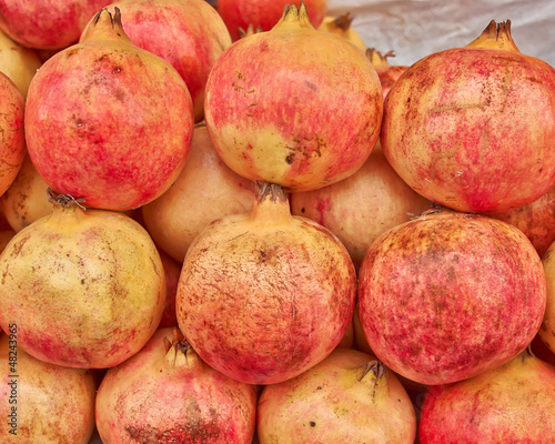 Photo: pomegranates closeup, natural background pomegranates closeup, natural background