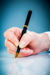 Woman's hand and pen