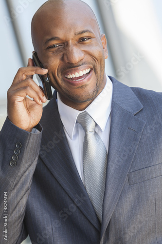 Photo: African American Businessman Talking on Cell Phone African American Businessman Talking on Cell Phone