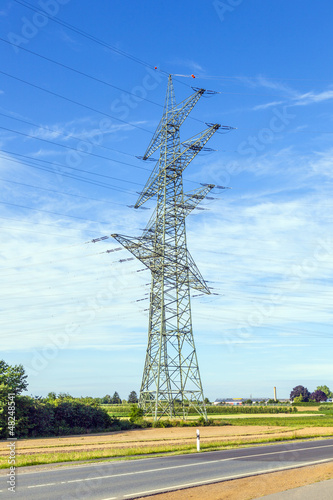 Photo: electrical power in field with street electrical power in field with street