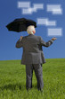 Foto: Businessman In Green Field Umbrella & Screens Businessman In Green Field Umbrella & Screens