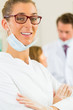 Dentist in her surgery