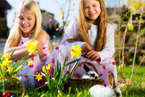 Photo: Children on Easter egg hunt with bunny Children on Easter egg hunt with bunny