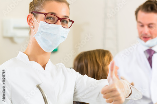 Photo: Dentist in her surgery Dentist in her surgery