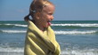 Child Spinning in her Towel after Bathing in the Sea
