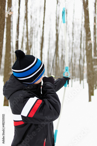Photo: Boy shooting with the bow Boy shooting with the bow