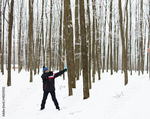 Photo: Boy shooting with the bow Boy shooting with the bow
