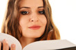 Young woman reading a book isolated on white