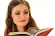 Young woman reading a book isolated on white