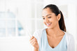 Happy Indian woman taking pregancy test