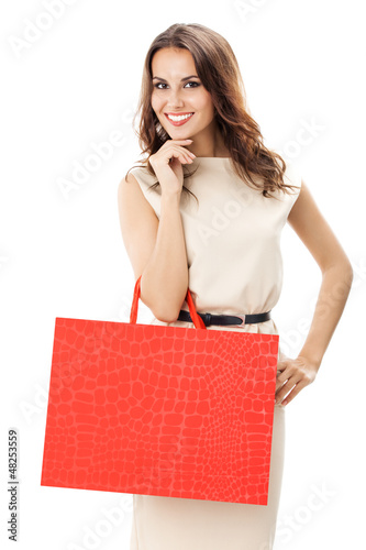 Photo: Young happy woman with shopping bags, isolated Young happy woman with shopping bags, isolated