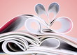 Romantic heart of magazines on a red background