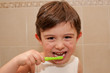 Photo: Cute boy washing his teeth Cute boy washing his teeth